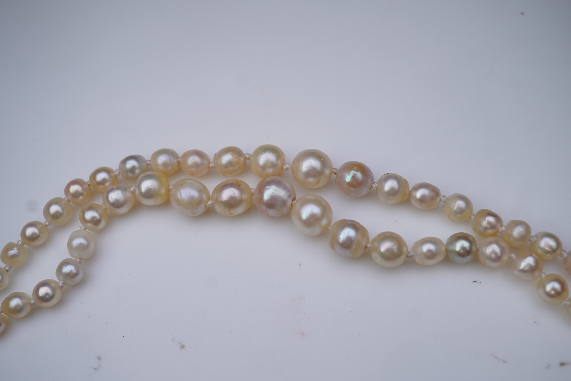 A natural pearl and diamond necklace, early 20th century